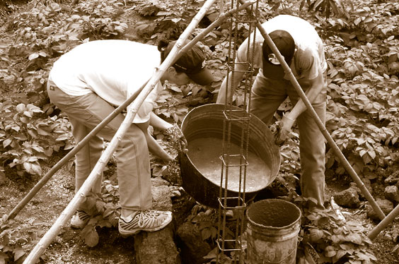 volunteer team pouring conrete